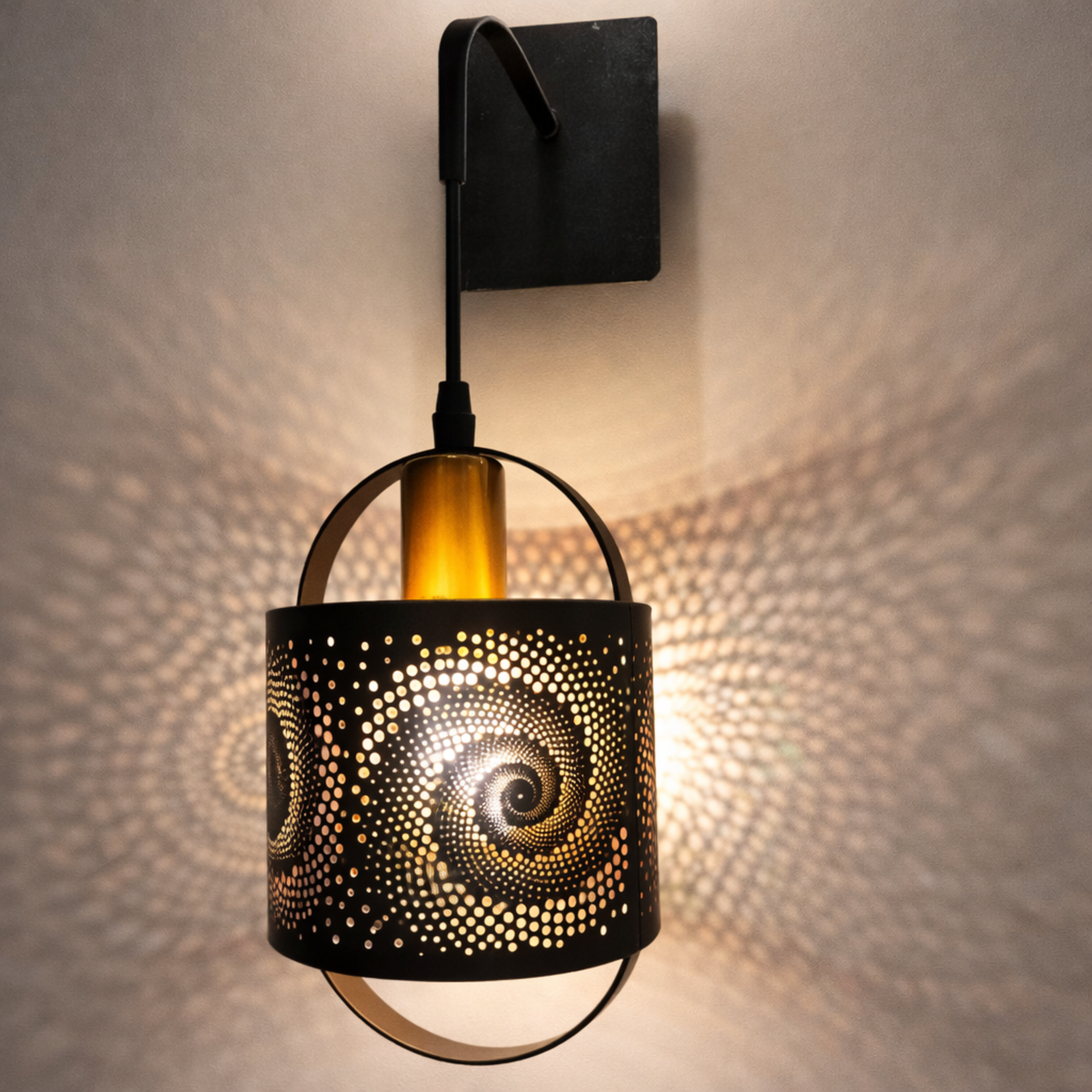Designer wall light with captivating spiral design casting artistic light patterns on wall. Ideal for ambient lighting in modern home decor.