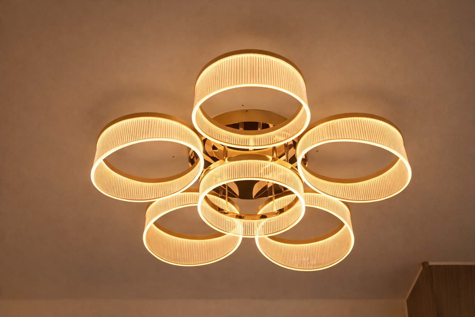 Halo Symphony Luxury Gold Ring LED Ceiling Light with six circular rings, offering elegant modern illumination for upscale home interiors.