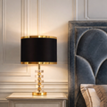Luxury LED Lamp for Modern Home Décor with gold and black finish on a bedside table. Premium design ideal for elegant bedroom lighting.