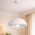 Luxury LED pendant lighting with sculptural white shade, ideal for modern interiors. Emits a warm glow, perfect for elegant home décor.