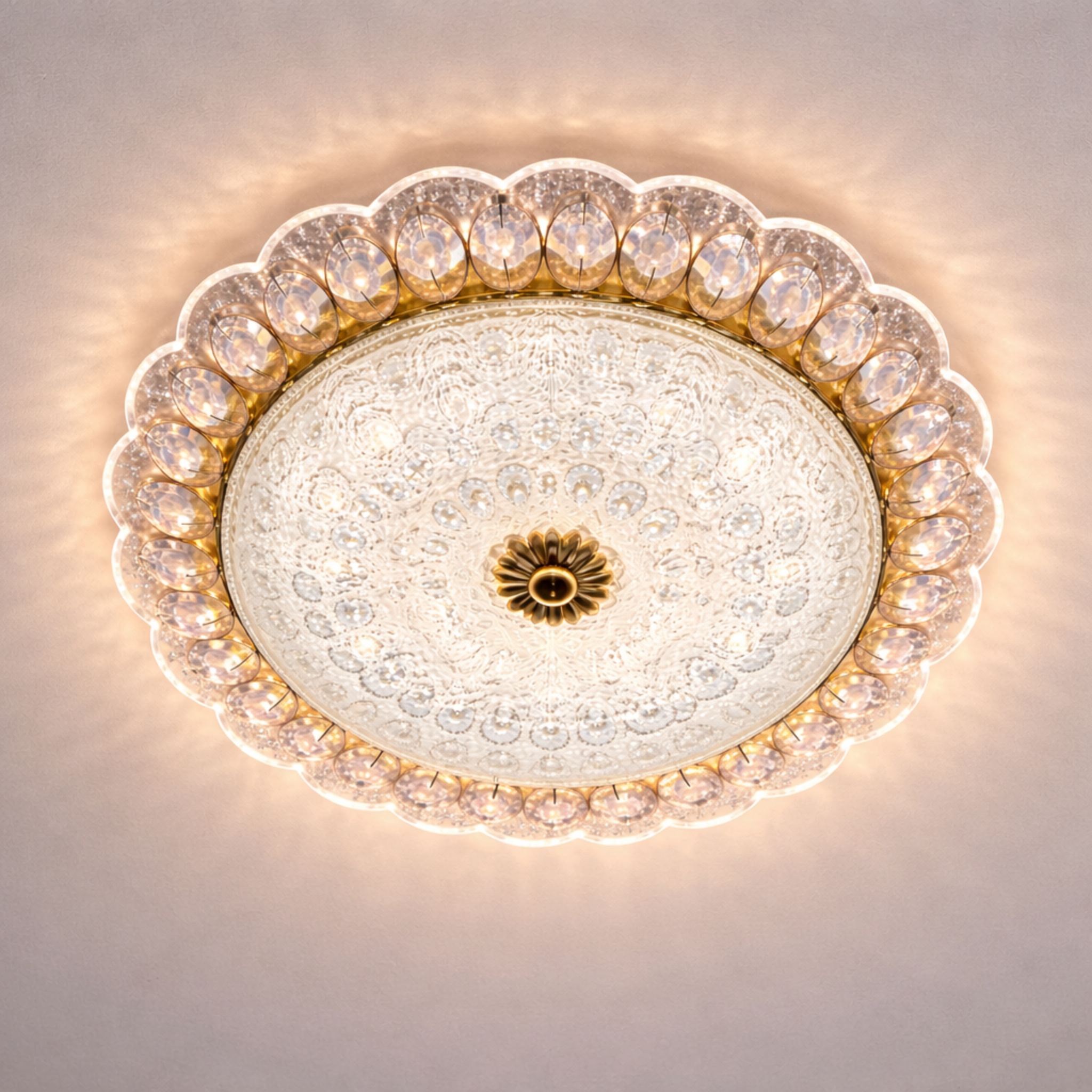 Luxury crystal LED ceiling light with intricate gold detailing and ambient glow, ideal for elegant interiors and energy-efficient lighting.