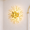 Gold Wall Sconce India with sculptural leaf and branch design, ideal for luxury decor lighting in elegant interior spaces.