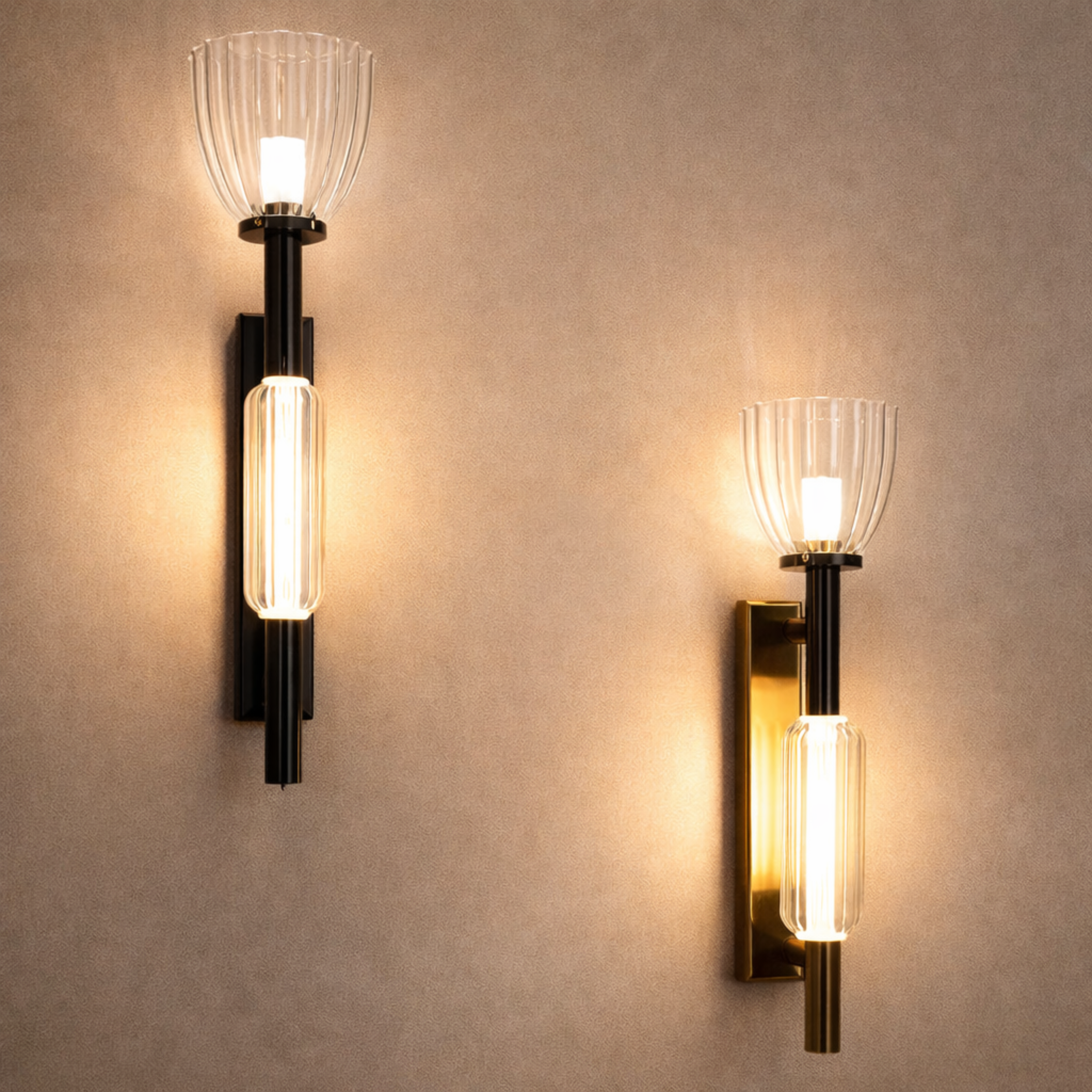 Aurielle Duo luxury dual glass wall light with elegant ribbed glass shades and LED bulbs, mounted on matte black and gold backplates.