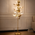 Aurelia Vine Floor Lamp with gold leaf sculptural design and ambient lighting, ideal for elegant living room interiors.