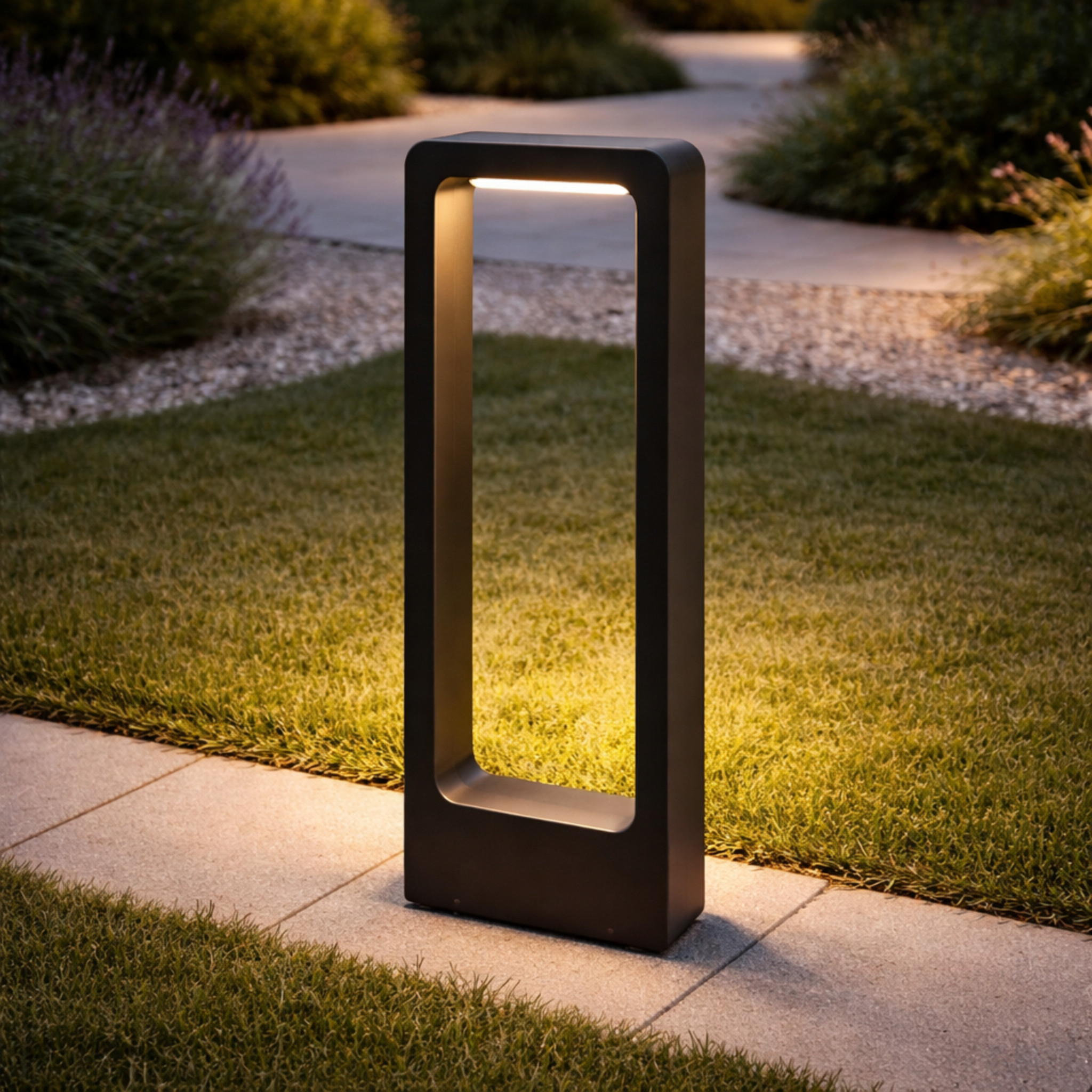 Rectangular LED Outdoor Light illuminating a garden pathway with soft, glare-free lighting. Shop Rectangular LED Outdoor Light for luxury landscape lighting.