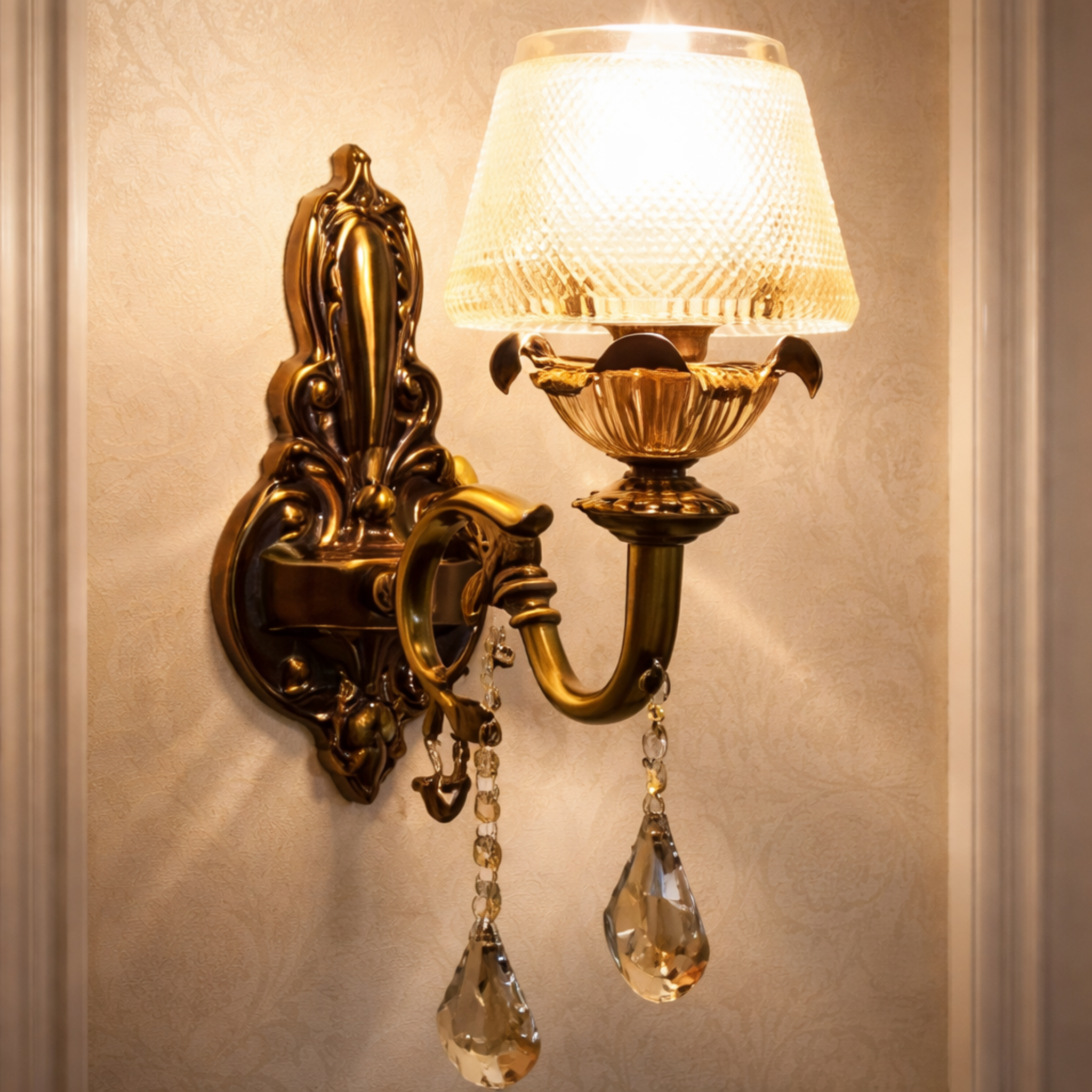 Imperial Aurelia Luxury Gold Crystal Wall Sconce with ornate brass finish and teardrop crystals, ideal for elegant home lighting décor.