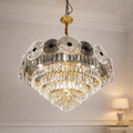 Aurelia Gold Design luxury chandelier with crystal tiers and floral accents, ideal for upscale interiors in homes, hotels, or villas in India.