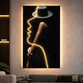 LumiCanvas – LED Illuminated Wall Art featuring a minimalist neon outline of a woman in a hat, glowing warmly in a modern living room. Unique LED design enhances luxury decor.