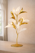 Gold Designer LED Table Lamp with sculpted leaf design and soft white petals, perfect for modern décor and luxury interior lighting.