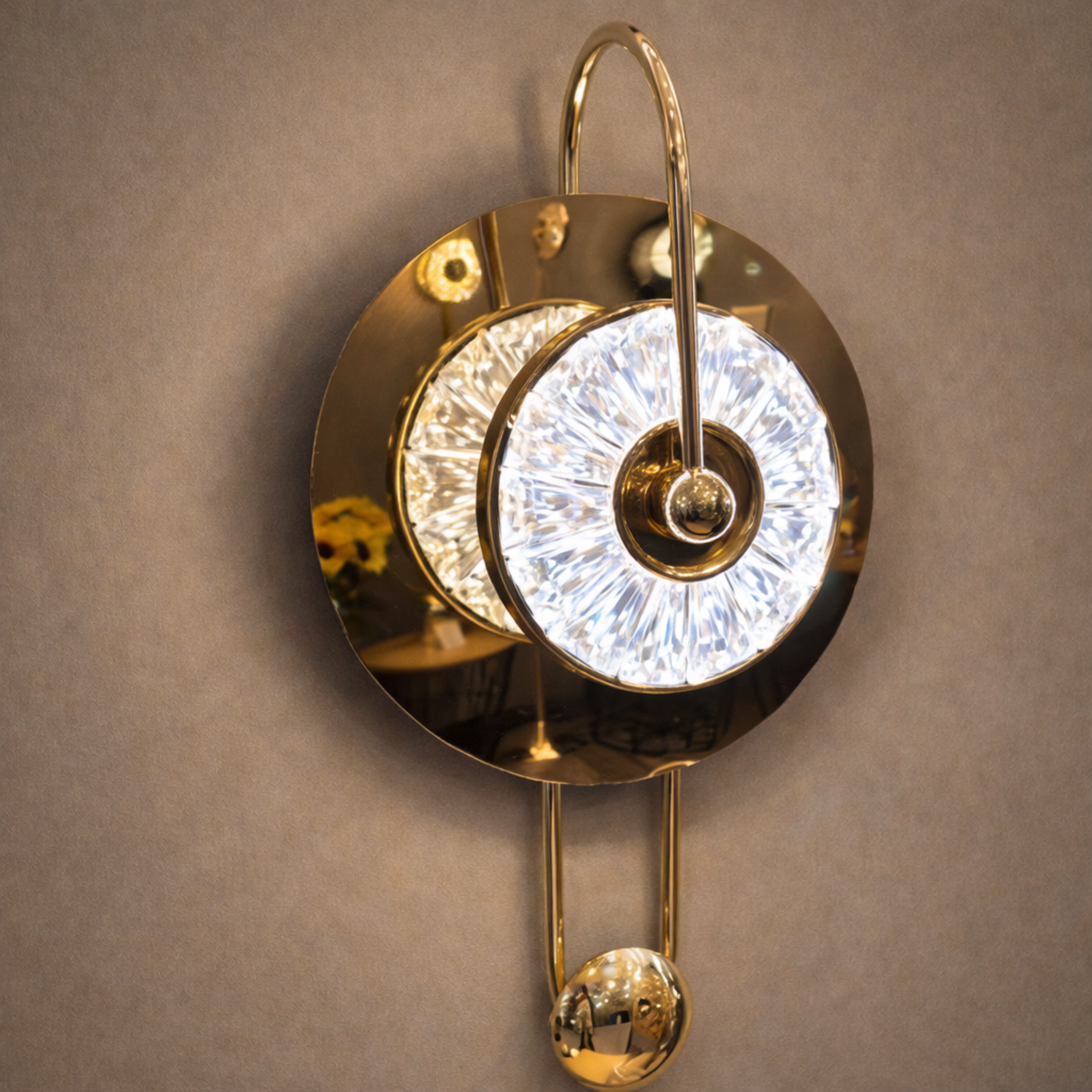 Elegant Crystal LED Wall Sconce with radiant halo design and gold finish, ideal for luxury interiors and ambient lighting in modern homes.