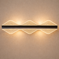 WaveLux Aura Wall Light - Modern LED wall light with artistic wave design and ambient glow, ideal for luxury home interiors and contemporary spaces.