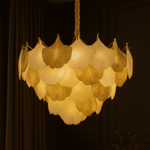 Luxury chandelier with layered gold and white flower-shaped lampshades hanging in a sophisticated interior setting.